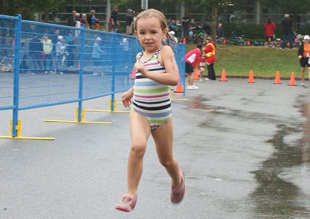 A young runner striving for personal best and having fun! Taken while participating at a youth triathlon.
